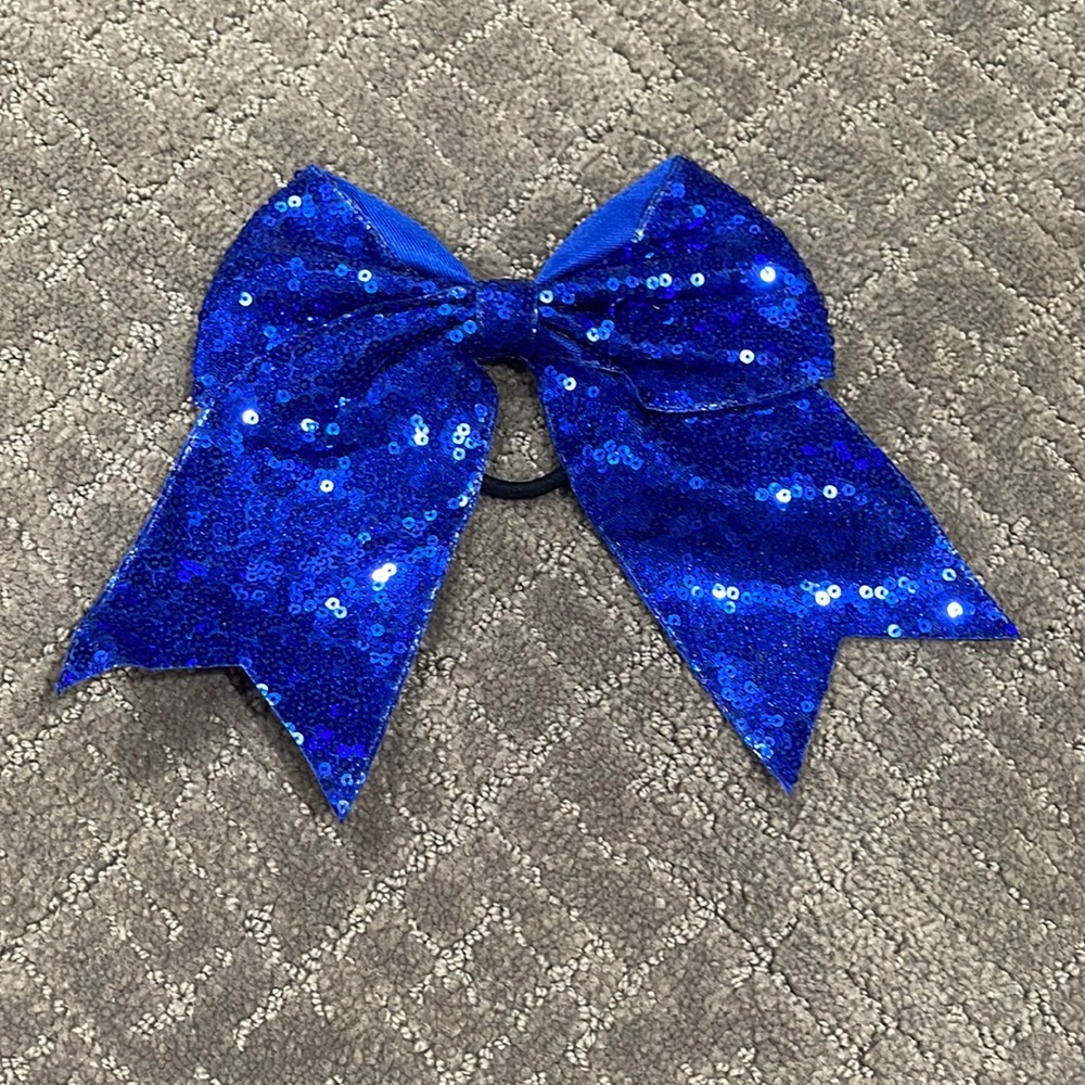Sparkly blue cheer bow.